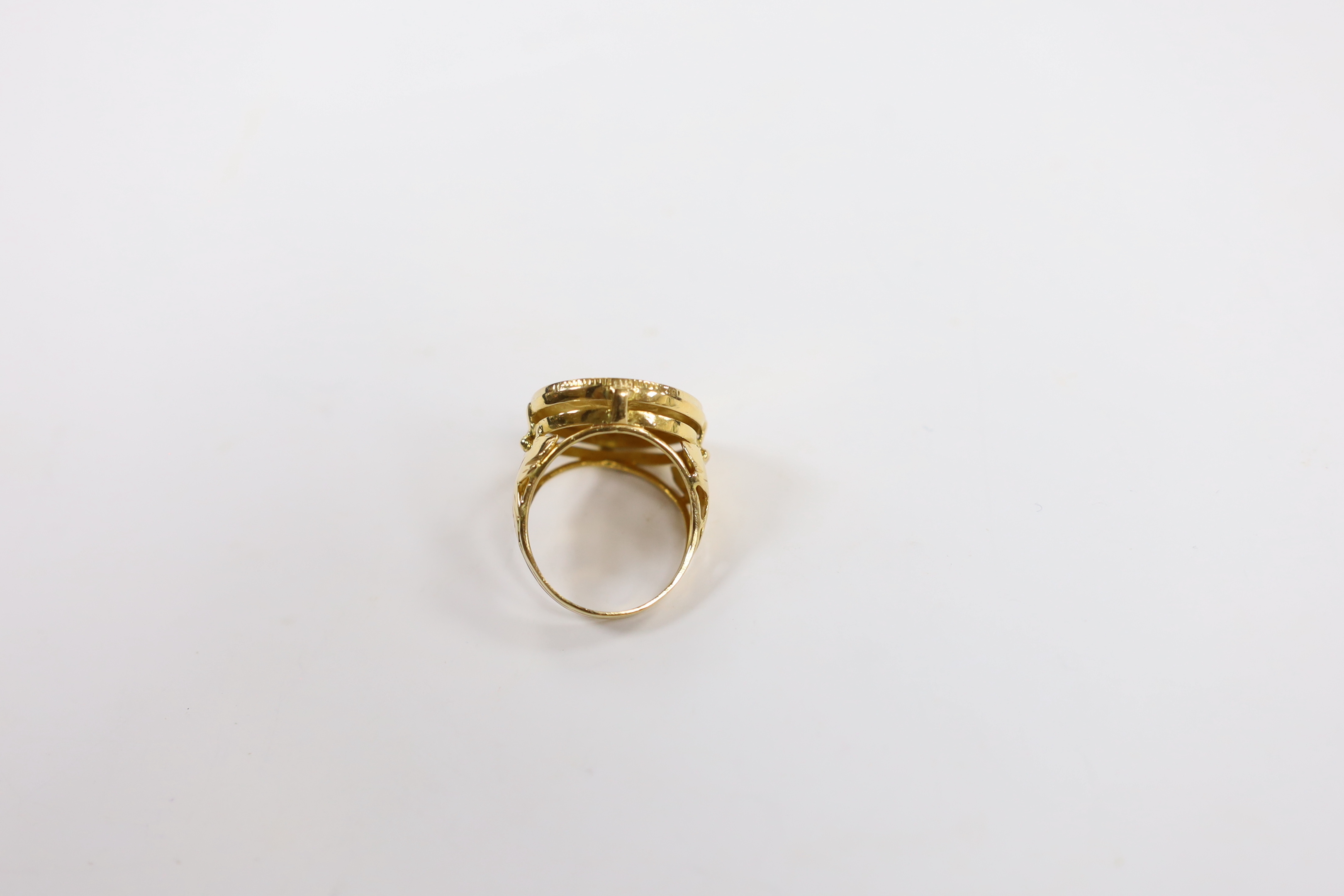 A 1912 gold half sovereign, now in yellow metal ring mount, size P, gross 9.4 grams.